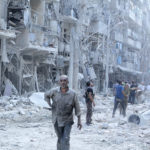 Residents look for survivors at a damaged site after what activists said was a barrel bomb dropped by forces loyal to Syria's President Bashar al-Assad in the Al-Shaar neighbourhood of Aleppo, Syria September 17, 2015. REUTERS/Abdalrhman Ismail - RTX242XG