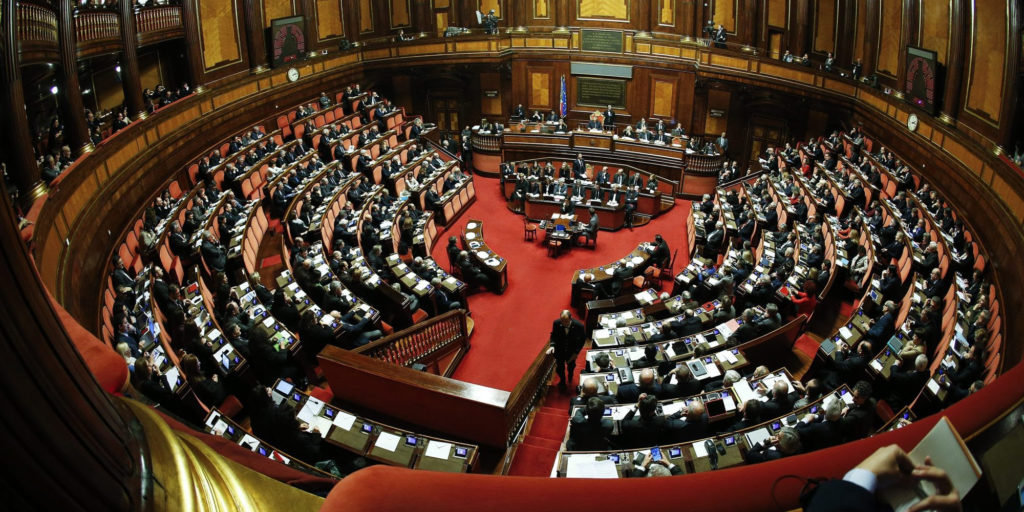 Italy's Prime Minister Matteo Renzi talks during a confidence vote at the Senate in Rome February 24, 2014. Renzi faces his first test before a fractious national parliament on Monday when he goes to the Senate to put flesh on ambitious reform plans and seeks to win a confidence vote in his newly installed government. REUTERS/Tony Gentile  (ITALY - Tags: POLITICS)